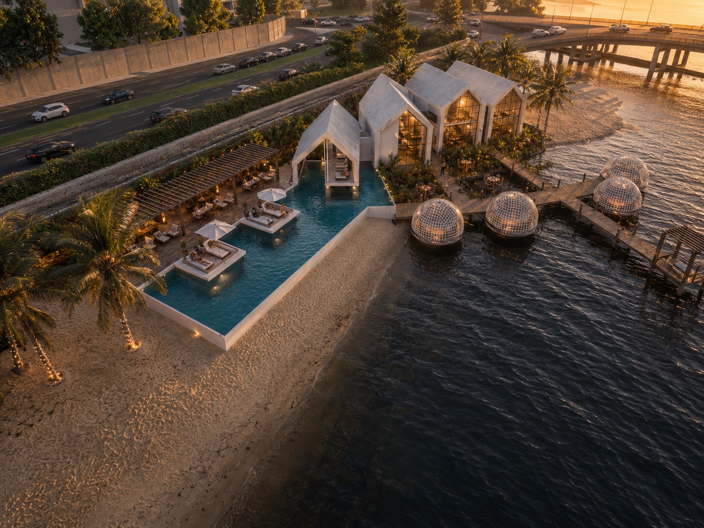 Aerial view of Mako Riverside, its beach huts, pool and floating pods